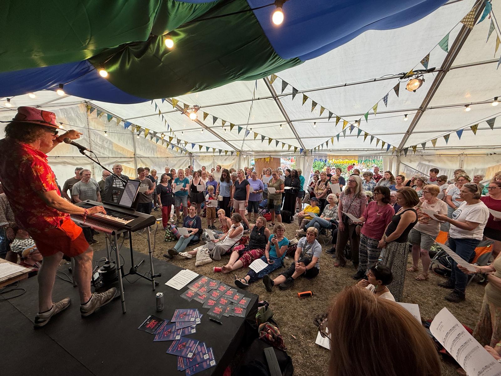 Richard Swan leading a voice-finding workshop at a festival